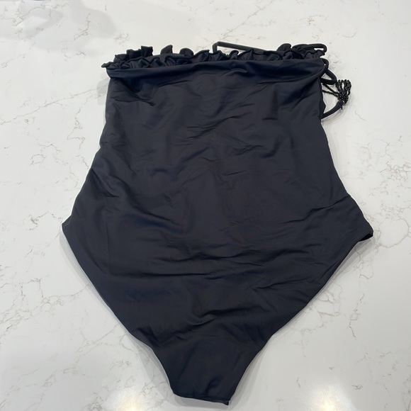 Palmacea, one piece, tied swimsuit with cut outs.  
Size M - Picture 5 of 12